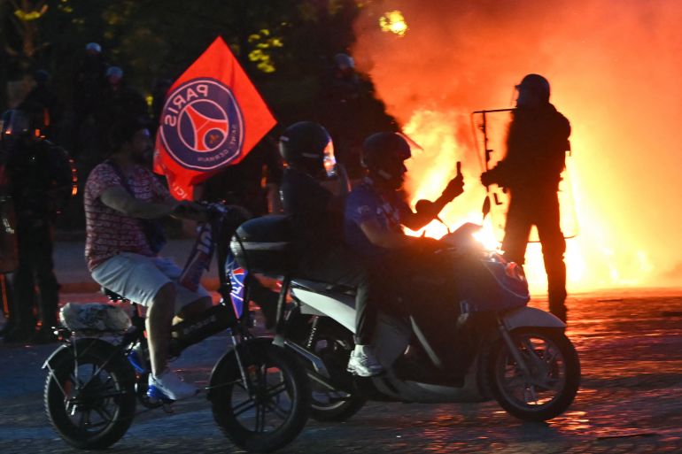 France detains 416 people after PSG Champions League win sparks riots.