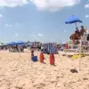Lifeguard Impaled by Umbrella Vows to Return Despite Injuries, Highlighting Beach Safety Risks